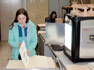 Pirscilla replaces a specimen after capturing image for internet